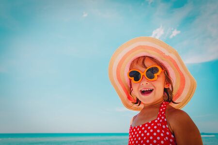 happy little girl enjoy summer at beachの写真素材
