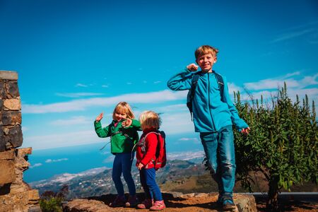 happy kids enjoy travel in mountainsの写真素材