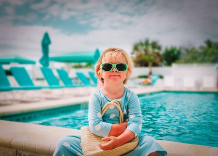 cute little girl on vacation in tropical beach resortの写真素材