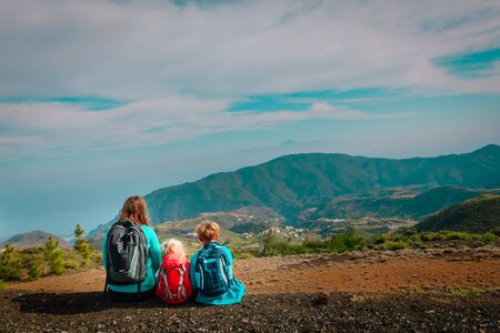 Mother with kids travel in mountains, family hiking in natureの写真素材