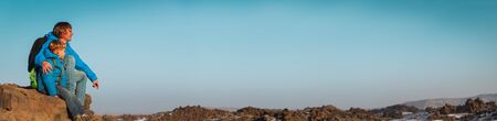 father and son travel hiking in mountains, panorama