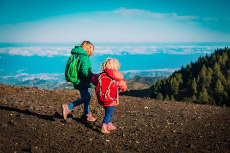 little girls travel in mountains, family hikingの写真素材