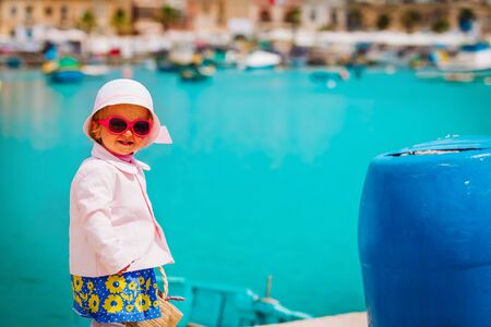 cute little baby girl travelling in Malta, Europeの写真素材