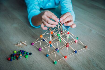 child making geometric shapes, engineering and STEM education