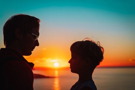 silhouette of father and son at sunset, parentingの写真素材
