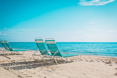 Beach chairs on tropical vacation, travel to sea conceptの写真素材