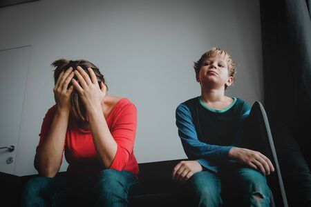 sad child with stressed mother, teenager problemsの写真素材