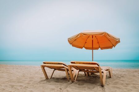 Beach chairs on tropical vacation, travel to sea conceptの写真素材