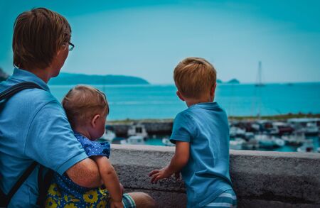 family -father with little son and daughter- looking at port of Dubrovnik, Croatia, travel concept