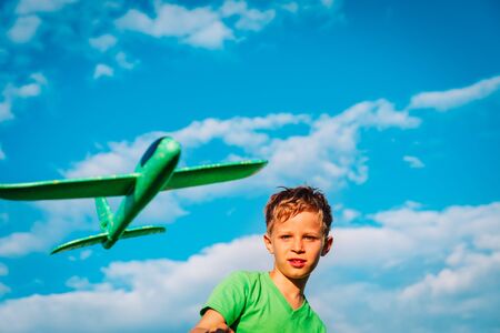 happy boy play flying toy play at skyの写真素材
