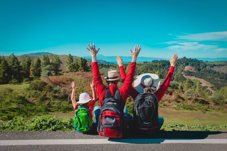 happy family-mother, father with little daughter-enjoy travel in nature
