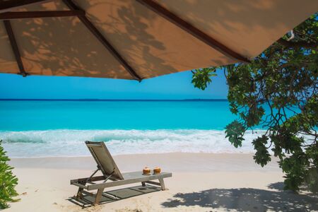 two coconut drinks on tropical beach resort