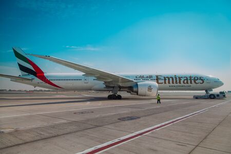 DUBAI, UAE - NOVEMBER 10: Emirates Boeing 777 at Dubai Airport on November 10, 2012 in Dubai, UAE.