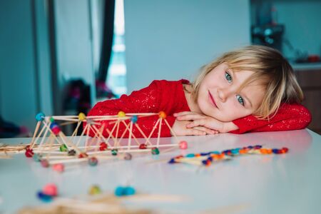 little girl making geometric shapes, engineering and STEM