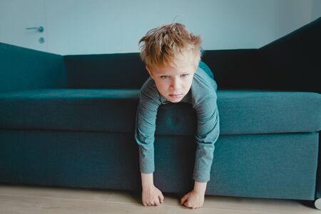sad and stressed kid, tired and exhausted child at home