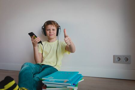 happy boy enjoy distant learning at home, online education for kidsの写真素材