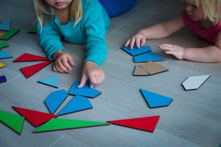 kids playing with puzzle, educational games at homeの写真素材