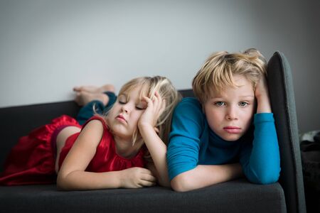 kids- boy and girl -bored staying homeの写真素材