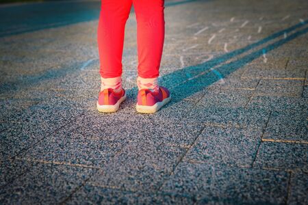little girl playing hopscotch on playground, kids play outdoors