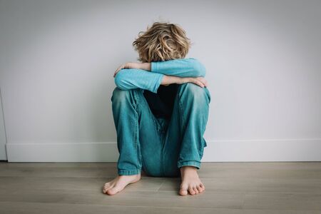 boy feeling anxiety and stress, kid staying homeの写真素材
