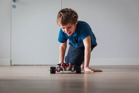 boy testing robot that he built at home, STEM for kidsの写真素材