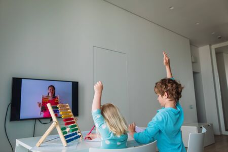 kids learning at home, boy and girl doing online math lesson