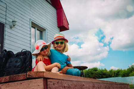 little girls travel to the country house, kids spend summer in the countryの写真素材