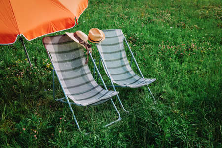 two chairs on green grass, relax in summer natureの写真素材