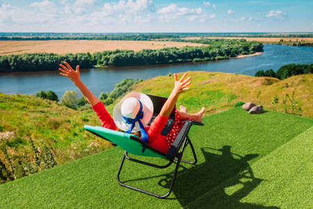 remote work - young woman working with laptop in the countryの写真素材