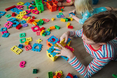 kids playing with puzzle, education concept, learning through playの写真素材