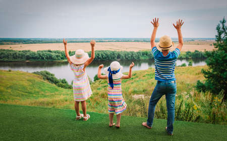 happy kids enjoy travel in nature, boy and girls hands upの写真素材
