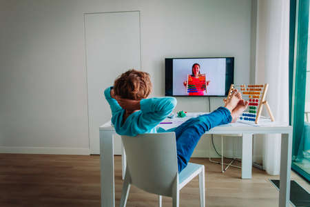 kid relax during online lesson, difficulty of distant learningの写真素材