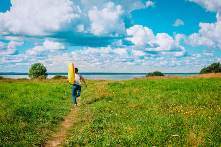 happy boy run to beach, vacation conceptの写真素材
