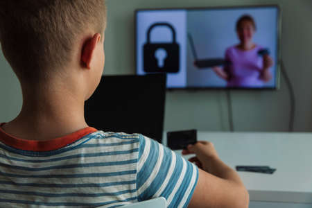 Teaching kid online security before paying online, safety on internetの写真素材