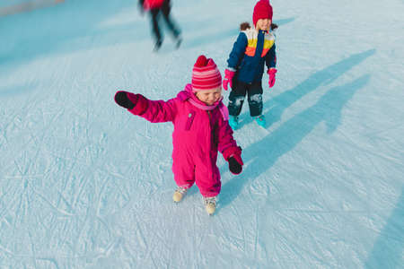 little girls skating in winter, family sport