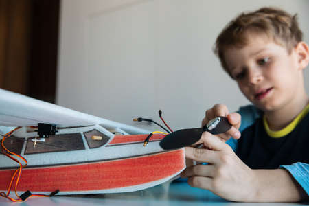 boy making model of plane, kids engineeringの写真素材