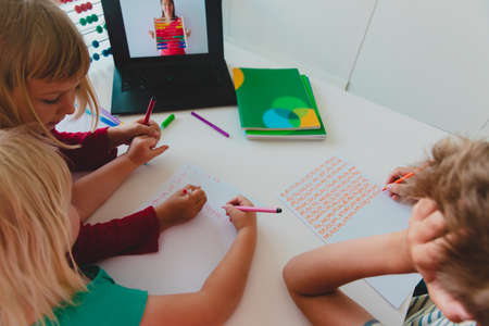 kids learning at home,family having online math lessonの写真素材