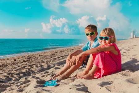 happy cute little boy and girl enjoy beach vacationの写真素材