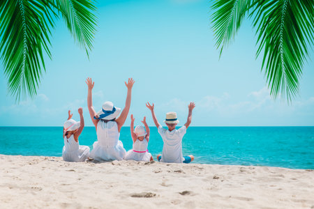 happy family -mother with son and daughters on beachの写真素材