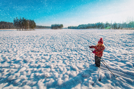 happy cute girl ski in winter nature, kids seasonal sportの写真素材