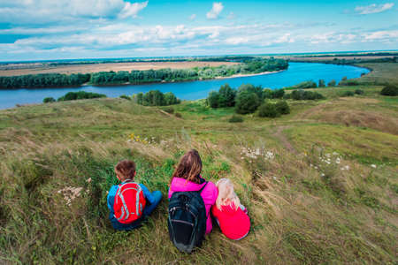 mother and kids travel in nature, family looking at scenic viewの写真素材