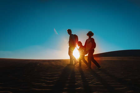 father with kids hiking at sunset, family travel in natureの写真素材