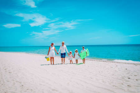 happy family with three kids on beach vacationの写真素材