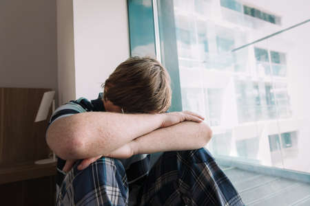 depression from staying at home, stress and exhastion, mental challengeの写真素材