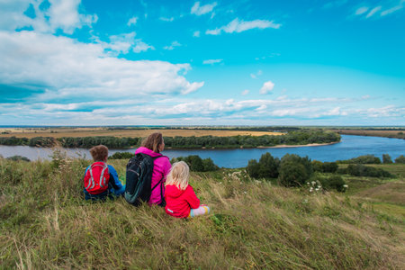 mother and kids travel in nature, family looking at scenic viewの写真素材