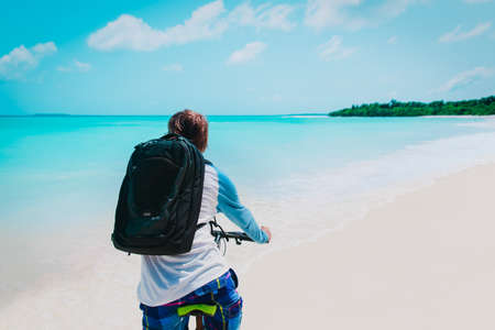 Ride on bike on the beach. Sport and active life concept