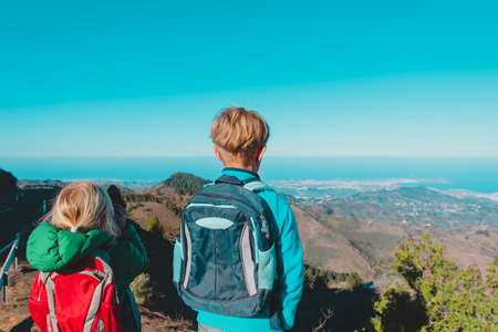 boy and girl travel in mountains, family hiking in nature, brother and sister outdoorsの写真素材