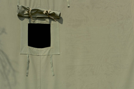 opened window of military tentの写真素材