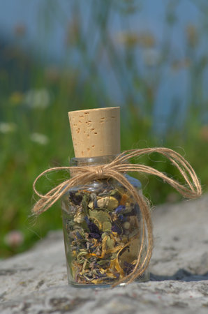 glass bottle with  dried mountain herbsの写真素材