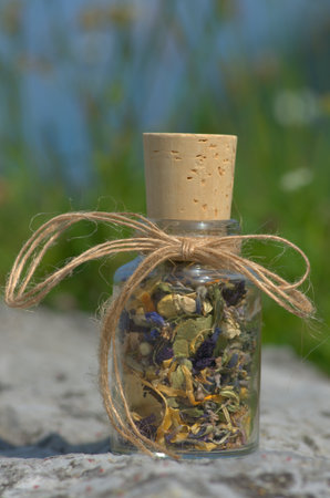 glass bottle with  dried mountain herbsの写真素材
